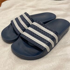 Adidas Adilette slides. Navy/ white stripes